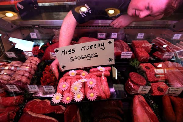 Butcher Connor Wilson from David Bennett and Son with his "Miss Murray Sausages"  in Andy Murray's home town of Dunblane. Picture: PA