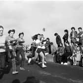 Women taking part in the traditional Shrove Tuesday pancake race along Portobello promenade in February 1982.