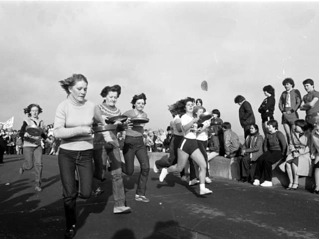 Women taking part in the traditional Shrove Tuesday pancake race along Portobello promenade in February 1982.