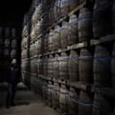 Iain McAlister (master distiller and distillery manager) tours the bonded warehouse checking on the maturing casks, at Glen Scotia single malt whisky distillery, in Campbeltown, Scotland, 26 February 2020.