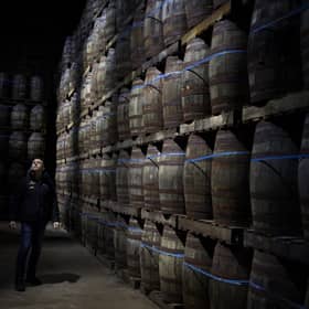 Iain McAlister (master distiller and distillery manager) tours the bonded warehouse checking on the maturing casks, at Glen Scotia single malt whisky distillery, in Campbeltown, Scotland, 26 February 2020.