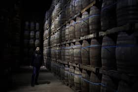 Iain McAlister (master distiller and distillery manager) tours the bonded warehouse checking on the maturing casks, at Glen Scotia single malt whisky distillery, in Campbeltown, Scotland, 26 February 2020.