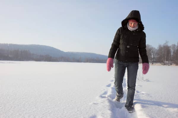 A Generic Photo of a woman walking in snow at Christmas. See PA Feature CHRISTMAS Health Hazards. Picture credit should read: PA Photo/thinkstockphotos. WARNING: This picture must only be used to accompany PA Feature CHRISTMAS Health Hazards.