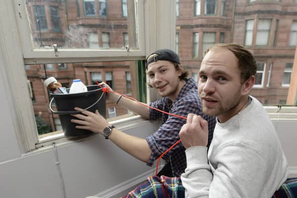 Jamie Stewart, 19 and Josh Still, 21, demonstrate how the zip wire worked. Picture: SWNS