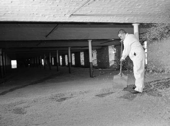 A distillery worker at the old Caledonian Distillery in 1960. Picture: TSPL