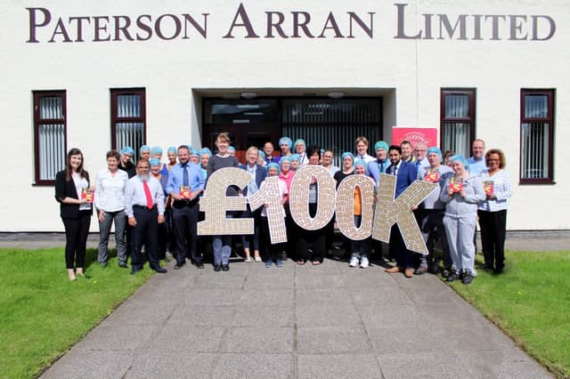 Picture: Patersons Shortbread staff celebrate raising £100,000 for Macmillan, supplied
