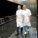 TO GO WITH AFP STORY BY EMMY VARLEY
French chef Michel Bras (R) and his son Sebastien pose at their new restaurant in the Soulages museum in Rodez, southern France, on March 25, 2014. AFP PHOTO JOSE TORRES        (Photo credit should read JOSE TORRES/AFP/Getty Images)