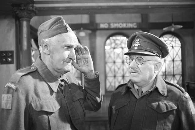 John Laurie, as Private Frazer, and Arthur Lowe, as Captain Mainwaring, during an episode of BBC comedy Dad's Army in 1977 (Picture: McCarthy/Express)