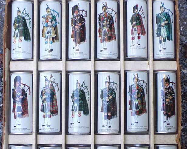 A set of cans featuring Scottish pipers.