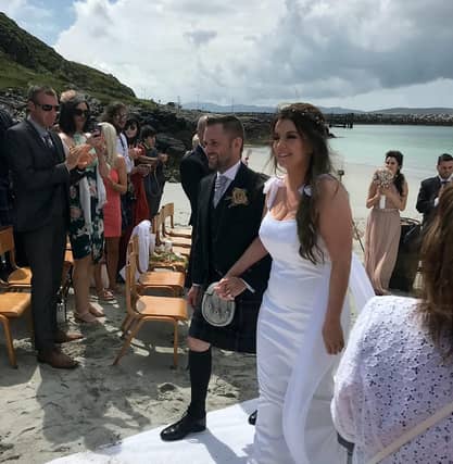 Stephanie Harkins, 33, and husband Stuart, 33, at their wedding..An Irn Bru obsessed bride received her perfect wedding gift when her new husband gave her a hamper full of the original recipe soft drink at their ceremony on the Isle of Eriskay, Outer Hebrides. See SWNS story SWSCdrink. A bride obsessed with Irn Bru was delighted when her new husband gave her a hamper full of the original recipe drink - as a wedding gift. Stephanie Harkins, 33, wed Stuart, 35, last week on the Isle of Eriskay, Outer Hebrides. Stephanie, a primary school teacher, had saved three cans of the original recipe Irn Bru in the lead up to the big day to relieve her pre-wedding stress. But she was delighted when hubby Stuart surprised her with the ultimate wedding gift - 24 cans of Scotland's national drink.