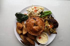 Leek, Onion & Comte Pie served with roasted Cabbage, Broccoli and chilli and Celeriac Slaw