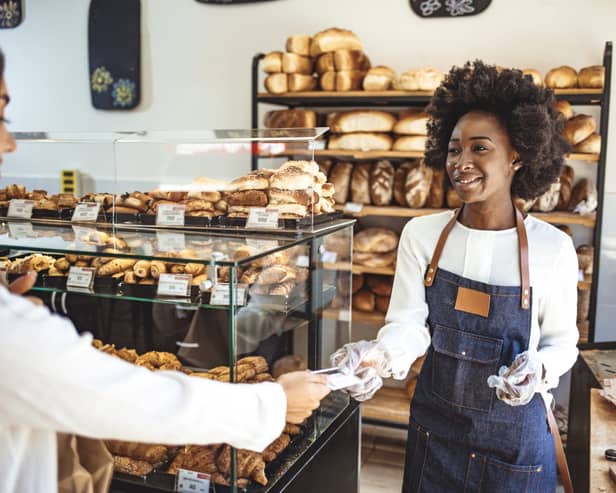 Customer making a credit card payment in a bakery.