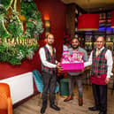 Habibur Khan with Radhuni waiting staff Azharul Jalil and Syed Urshad Ali. Photo by Gavin Hill.