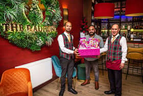 Habibur Khan with Radhuni waiting staff Azharul Jalil and Syed Urshad Ali. Photo by Gavin Hill.