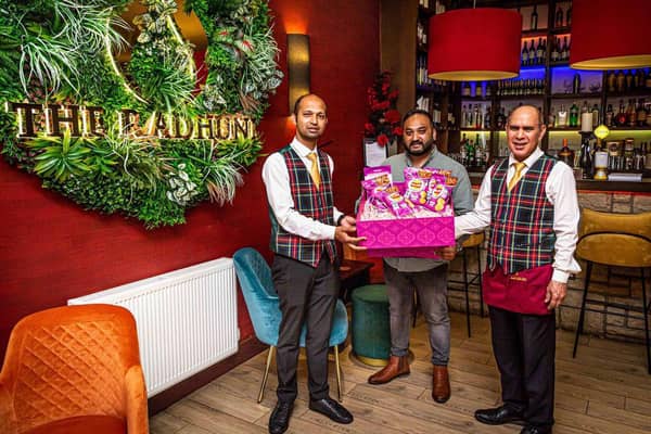 Habibur Khan with Radhuni waiting staff Azharul Jalil and Syed Urshad Ali. Photo by Gavin Hill.