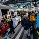 Volunteers wait to help refugees from Ukraine arriving at the main train station in Berlin, Germany (Picture: Hannibal Hanschke/Getty Images)
