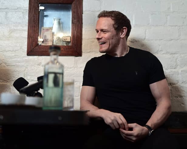 21/02/2023. Glasgow. THE UBIQUITOUS CHIP, Ashton Lane.

Portrait of actor, Sam Heughan for article by Rosiland Erskine in Scran.

Sam Roland Heughan (/ËahjuËÉ™n/; born 30 April 1980) is a Scottish actor, producer, author, and entrepreneur. He is best known for his starring role as Jamie Fraser in the Starz drama series Outlander (2014â€“present) for which he has won the People's Choice Award for Favorite Cable Sci-Fi/Fantasy TV Actor and the Saturn Award for Best Actor on Television, and received a nomination for the Critics' Choice Television Award for Best Actor in a Drama Series.

Heughan has also starred in films such as the spy comedy The Spy Who Dumped Me (2018), The Empty Train, and the superhero action film Bloodshot (2020). Among his numerous plays he was nominated for the Laurence Olivier Award for Most Promising Performer for his performance in Outlying Islands performed at the Royal Court Theatre Upstairs.[1][2]

Heughan and his Outlander co-star Graham McTavish co-wrote Clanlands: Whisky, Warfare, and a Scottish Adventure Like No Other[3] which reached number one on the New York Times' Best Seller List for hardcover nonfiction, and combined print and e-book nonfiction in November 2020.[4] The same year Heughan launched his own whisky brand, The Sassenach (named after his Outlander character's nickname for his wife, Claire[5]), winning consecutive double golds in the 2020 and 2021 San Francisco World Spirits Competition.