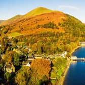 A view of Loch Lomond on a clear, sunny autumn day, with the village of Luss at the left hand side, and Ben Lomond on the horizon.