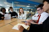 Education Secretary Mairi McAllan, pictured meeting students as they receive their exam results at Broughton High School last month, must change course if all pupils are to have a chance of fulfilling their potential (Picture: Jeff J Mitchell)