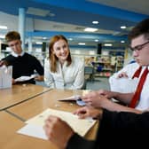Education Secretary Mairi McAllan, pictured meeting students as they receive their exam results at Broughton High School last month, must change course if all pupils are to have a chance of fulfilling their potential (Picture: Jeff J Mitchell)