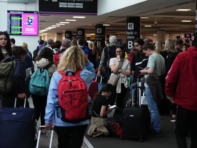 Passengers at Edinburgh Airport as widespread IT outages affecting airlines caused long queues at airports