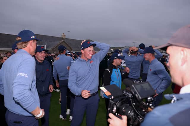 California-based Scot Niall Shiels Donegan celebrates with his GB&I team-mates following a dramatic victory in the 51st Walker Cup at Lahinch in County Clare