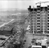 Modern housing under construction beside old tenements in the Gorbals area of Glasgow, c. 1960