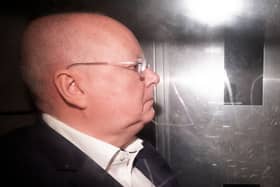Peter Murrell pictured in the back of a prison van