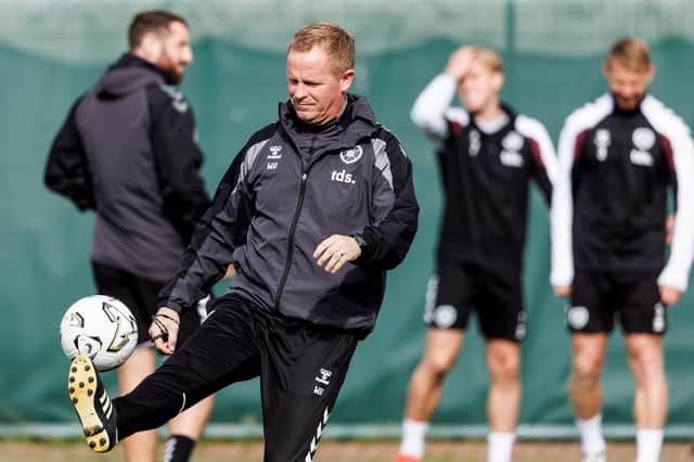 Hearts head coach Wouter Vrancken gets the ball under control during a training session.