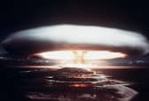 The tell-tale mushroom cloud of a nuclear explosion rises over Mururoa atoll in 1971