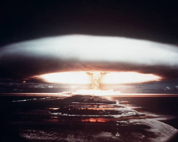The tell-tale mushroom cloud of a nuclear explosion rises over Mururoa atoll in 1971