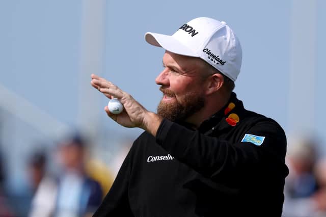 Home hero Shane Lowry of acknowledges the crowd on the 18th green after carding a course-record 62 on day two of the Amgen Irish Open at Trump International Golf Links in Doonbeg 