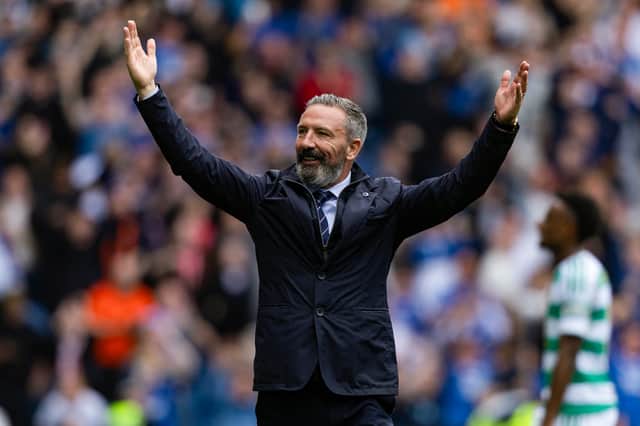 Rangers head coach Derek McInnes takes the acclaim of the fans after a 3-0 win over Celtic.