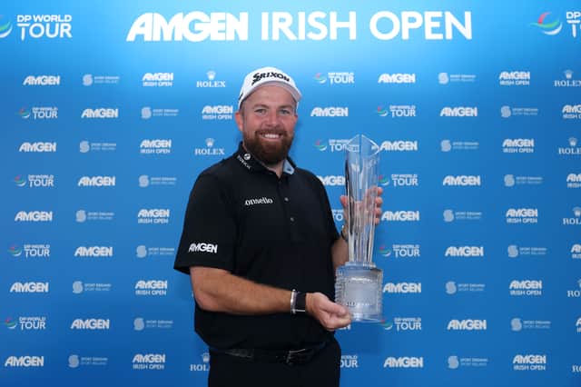 Shane Lowry shows off the trophy after winning the Amgen Irish Open for a second time, having also landed his home title as an amateur in 2009