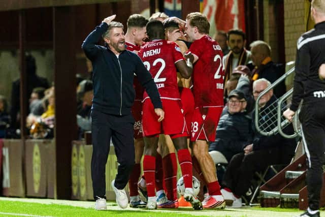 Aberdeen Manager Stephen Robinson celebrates as Ayoub Mouloua scores to make it 3-0 during a William Hill Premiership match between Motherwell and Aberdeen at Fir Park
