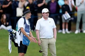 Bob MacIntyre shares a laugh with Jimmy Bullard, who was caddying for John Terry, during BMW PGA Championship pro-Am at Wentworth Golf Club 