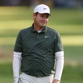 Bob MacIntyre reacts with a wry smile after holing his second shot for an eagle on the 15th hole on day two of the BMW PGA Championship at Wentworth 