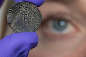 NMS curator Alice Blackwell inspect the David I penny which was discovered in Midlothian and valued at £15,000