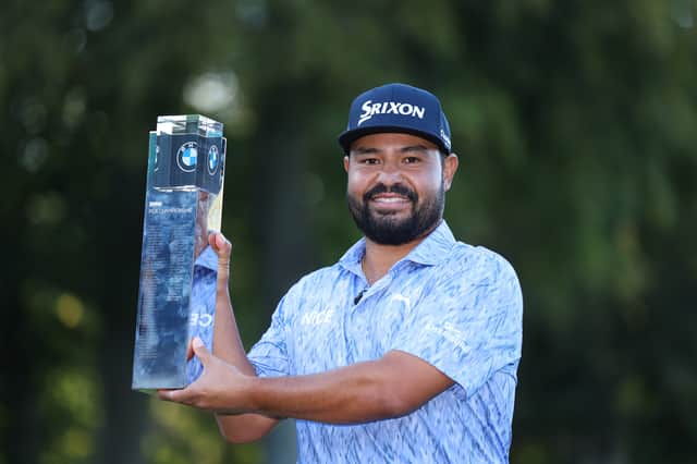 American JJ Spaun shows off the BMW PGA Championship trophy after his dramatic win at Wentworth