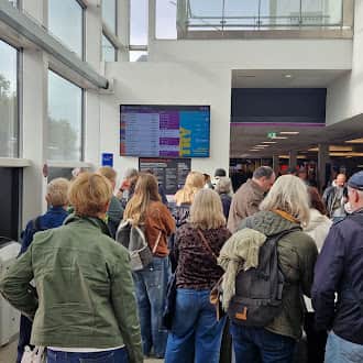 Passengers at Edinburgh Airport awaiting news of their flight amidst the air traffic control chaos