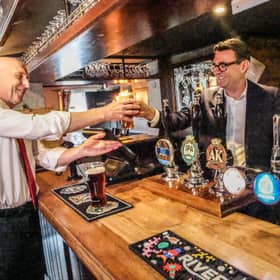 Prime Minister Andy Burnham, right, and Chancellor of the Exchequer John Healey during a visit to a pub in Harlow, Essex