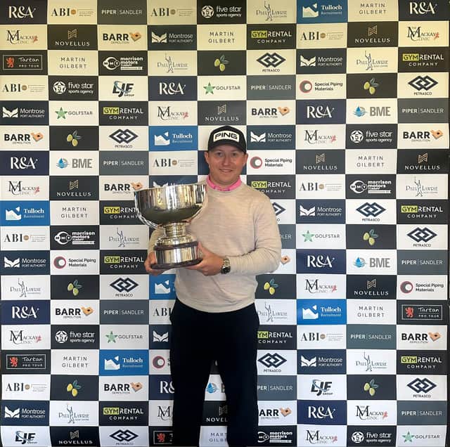 Craig Ross shows off the trophy after winning the St Andrews Classic presented by Petrasco
