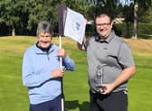 Scotcraig’s Ryan Campbell shows off The McAlpine Trophy after being presented with it at Blairgowrie by Hamish McAlpine, Kevin’s dad