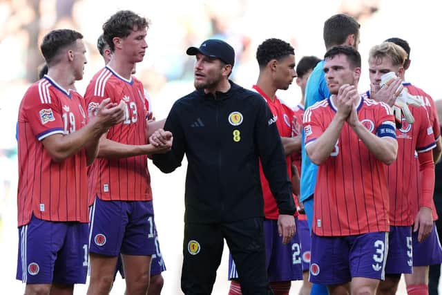Scotland head coach Sebastien Pocognoli (centre) with his players after the goalless draw against Slovenia at Stadion Stozice in Ljubljana.