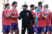 Scotland head coach Sebastien Pocognoli (centre) with his players after the goalless draw against Slovenia at Stadion Stozice in Ljubljana.