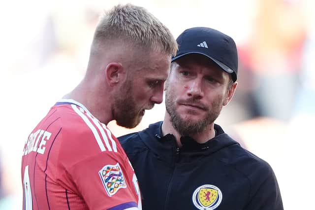 Scotland head coach Sebastien Pocognoli (right) and Oliver McBurnie after the Nations League draw with Slovenia at Stadion Stozice in Ljubljana.
