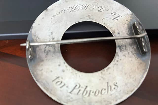 Undated handout photo issued by Bruce Cameron Williams of the inscription on his brooch
