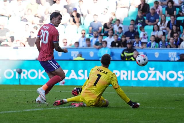 Scotland's Kieron Bowie (left) is denied by Slovenia goalkeeper Jan Oblak during the goalless draw in Ljubljana.