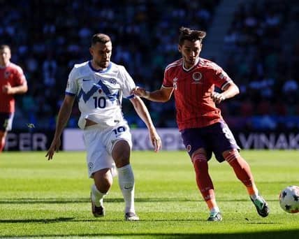 Scotland boss Sebastien Pocognoli lavished praise on returning midfielder Billy Gilmour after the draw with Slovenia. Cr: PA.