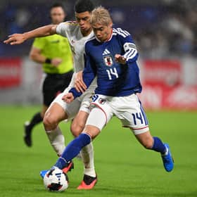 Rangers striker Kevin Kelsy battles with Junya Ito during Venezuela's international friendly with Japan on Monday afternoon. Cr: Getty Images.